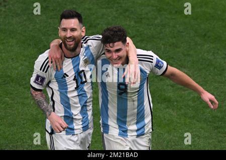 Lusail, Qatar. 13th Dec, 2022. Soccer, World Cup, Argentina - Croatia, final round, semifinal, Lusail Stadium, Argentina's Julian Alvarez celebrates with Argentina's Lionel Messi after scoring to make it 0-2. Credit: Robert Michael/dpa/Alamy Live News Stock Photo