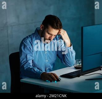businessman workingtired, stressed, overworked exhausted late night business computer man office technology light dark deadline work Stock Photo