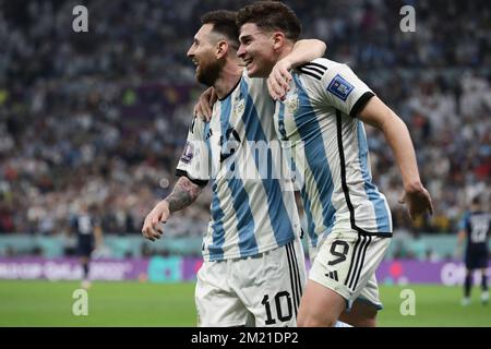 Argentina's forward Lionel Messi and Argentina's forward Julian Alvarez celebrates after scoring a goal against Croatia during the  World Cup FIFA Qatar 2022 round of semi-finals match between Argentina and Croatia at Lusail Stadium in Al Daayen, Qatar, on December 13, 2022. (Alejandro PAGNI / PHOTOXPHOTO) Stock Photo