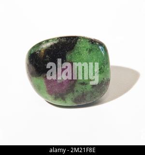 Macro close up colour photograph of 'Ruby Zoisite' a semi precious crystal gemstone used in crystal healing therapy Stock Photo