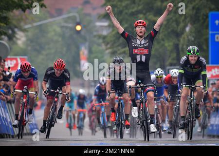 Belgian Zico Waeytens of Team Giant-Alpecin (C) celebrates as he wins before New-Zealand's Daniel McLay of Fortuneo-Vital Concept (R) the sprint at the finish of the final stage of the Baloise Belgium Tour cycling race, 174,2km from Tremelo to Tongeren, on Sunday 29 May 2016.  Stock Photo