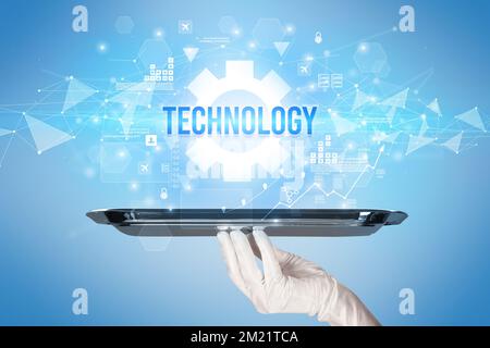 Waiter serving new technology concept Stock Photo