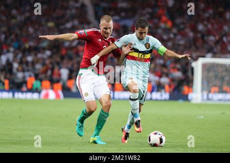 Hungary's Adam Lang and Belgium's Eden Hazard fight for the ball during a soccer game between Belgian national soccer team Red Devils and Hungary, in the round of 16 of the UEFA Euro 2016 European Championships, on Sunday 26 June 2016, in Toulouse, France. The Euro2016 tournament is taking place from 10 June to 10 July. BELGA PHOTO BRUNO FAHY Stock Photo