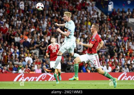 Belgium's Kevin De Bruyne and Hungary's Adam Lang pictured in action during a soccer game between Belgian national soccer team Red Devils and Hungary, in the round of 16 of the UEFA Euro 2016 European Championships, on Sunday 26 June 2016, in Toulouse, France. BELGA PHOTO DIRK WAEM Stock Photo