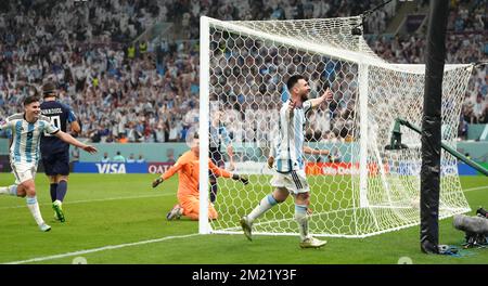 Argentina's Lionel Messi (right) celebrates after Julian Alvarez scores their side's third goal of the game during the FIFA World Cup Semi-Final match at the Lusail Stadium in Lusail, Qatar. Picture date: Tuesday December 13, 2022. Stock Photo