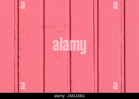 Vertical boards in light red crimson color paint wooden surface texture plank background. Stock Photo