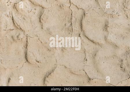 Beige clay wall with abstract pattern sand texture background. Stock Photo