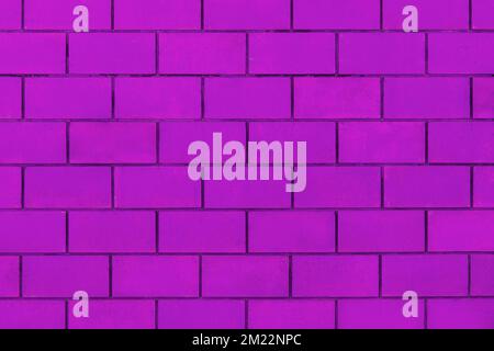 Purple lilac violet color paint on brick blocks urban design wall texture pattern background architecture stone abstract. Stock Photo