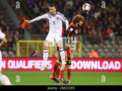 Bosnia's Haris Medunjanin and Belgium's Marouane Fellaini fight for the ball during a soccer match between Belgium's Red Devils and Bosnia and Herzegovina, the second World Championships 2018 Qualification game in Group H, on Friday 07 October 2016, in Brussels. BELGA PHOTO VIRGINIE LEFOUR Stock Photo
