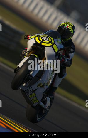 Valencia MotoGP Official Test. Test day 1. Circuit Ricardo Tormo, Valencia. In the picture:  wheelie of#29 ANDREA IANNONE (ITALIAN) TEAM SUZUKI ECSTAR SUZUKI Stock Photo