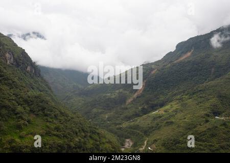 Beautiful shot of colombian deep valley with forest mountains and cloudy day at background Stock Photo