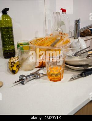 Pile of dirty utensils in a kitchen after party or dinner that should be cleaned Stock Photo