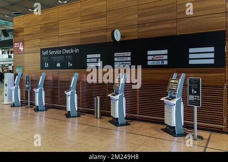 BERLIN, GERMANY - DECEMBER 12, 2022: Automated check-in at the Airport BER. Innovation at the service of people, automation and also staff reduction. Stock Photo