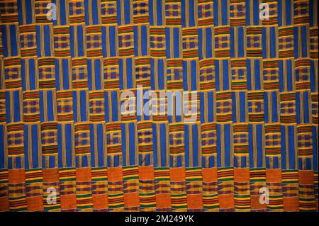 Ghana Men's Weave Kente cloth wall hanging in the Harold Washington Library Center, Chicago, IL. c. 1919  Cotton, silk, and rayon. Stock Photo