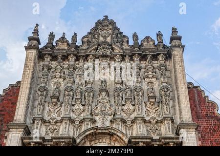 The baroque facade of the tabernacle of the Mexico City Metropolitan Cathedral in Mexico City, Mexico. The home cathedral of the Roman Catholic Archdiocese of Mexico is built on the secret temple of the Aztec empire and took nearly 250-years to complete mixing Gothic, Baroque, Churrigueresque, and Neoclassical styles. Stock Photo