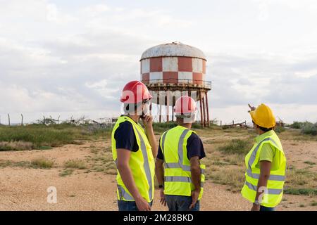 Engineers working in an industrial park Stock Photo