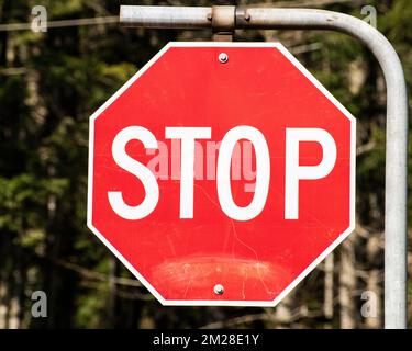 Stop sign at the highway junction in Hope, British Columbia, Canada Stock Photo