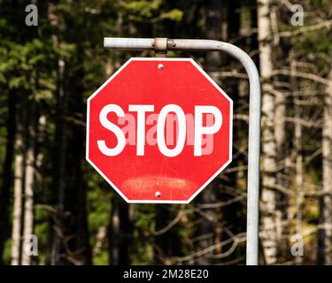 Stop sign at the highway junction in Hope, British Columbia, Canada Stock Photo