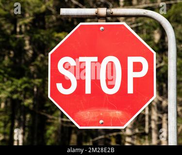 Stop sign at the highway junction in Hope, British Columbia, Canada Stock Photo