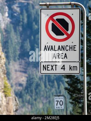 Avalanche area sign at the highway junction in Hope, British Columbia, Canada Stock Photo