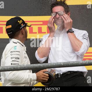 Mercedes' British driver Lewis Hamilton and Mercedes AMG Managing Director Andy Cowell celebrate on the podium after winning the Spa-Francorchamps Formula One Grand Prix of Belgium race, in Spa-Francorchamps, Sunday 27 August 2017. BELGA PHOTO BENOIT DOPPAGNE Stock Photo