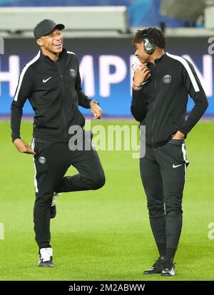 PSG's Kylian Mbappe and PSG's Christopher Nkunku pictured during on the field of the stadium as French soccer team Paris Saint-Germain made his training in Paris earlier today, Tuesday 17 October 2017 in Brussels. Tomorrow PSG is playing a game in the group stage (Group B) of the UEFA Champions League competition against Belgian soccer team RSC Anderlecht. BELGA PHOTO VIRGINIE LEFOUR Stock Photo