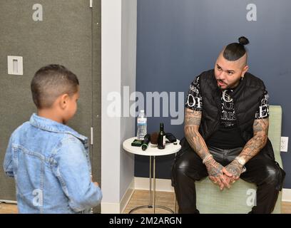 Miramar, USA. 10th Dec, 2022. MIRAMAR, FL - DECEMBER 10: El Chacal backstage talking to a young fans during Navidad Para Todos concert at Miramar Regional Park Amphitheater on December 10, 2022 in Miramar, Florida. (Photo by JL/Sipa USA) Credit: Sipa USA/Alamy Live News Stock Photo