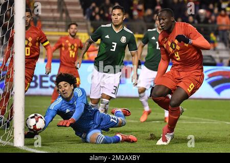 Mexico's goalkeeper Guillermo Ochoa (L) pictured as Belgium's Romelu Lukaku (R) scores the 2-1 goal during a friendly soccer game between Belgian national team Red Devils and Mexico, Friday 10 November 2017, in Brugge. BELGA PHOTO DIRK WAEM Stock Photo