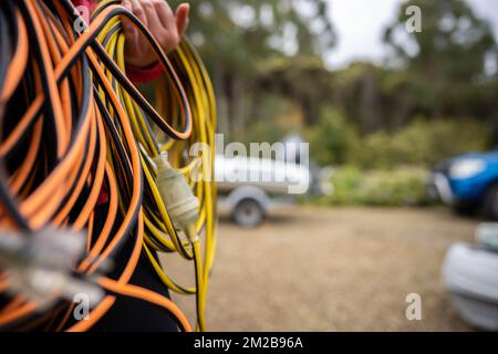 power lead on a building site, electrician with a power cable outside Stock Photo