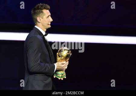 Former German soccer player Miroslav Klose holds the 2018 World Cup trophy during the draw for the 2018 World Cup soccer in Moscow, with Belgium team in pot one, Russia, Friday 01 December 2017. BELGA PHOTO DIRK WAEM  Stock Photo