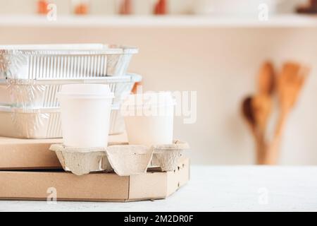 Set of different food delivery containers on white table Stock Photo