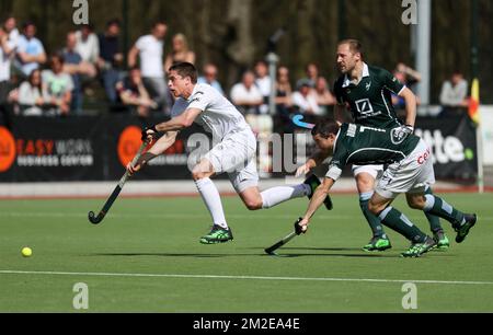 Racing's Jerome Truyens and Waterloo Ducks' John John Dohmen fight for the ball during a hockey game between Waterloo Ducks and Racing, in the Audi league hockey competition, Sunday 08 April 2018, in Waterloo. BELGA PHOTO VIRGINIE LEFOUR Stock Photo