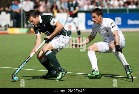 Waterloo Ducks' John John Dohmen and Racing's Jerome Truyens fight for the ball during a hockey game between Waterloo Ducks and Racing, in the Audi league hockey competition, Sunday 08 April 2018, in Waterloo. BELGA PHOTO VIRGINIE LEFOUR Stock Photo
