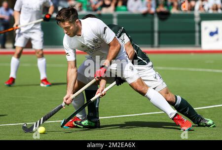 Racing's Cedric Charlier and Waterloo Ducks' John John Dohmen fight for the ball during a hockey game between Waterloo Ducks and Racing, in the Audi league hockey competition, Sunday 08 April 2018, in Waterloo. BELGA PHOTO VIRGINIE LEFOUR Stock Photo