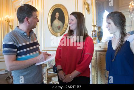 Journalist Pierre Nizet talks to Paralympian athlete Eleonor Sana and her sister Chloe before an audience with the winner of a bronze medal at the Paralympic Winter Games, Monday 07 May 2018 in Brussels. The Winter Paralympics took place in Pyeongchang, South-Korea from 09 to 18 March 2018. BELGA PHOTO BENOIT DOPPAGNE Stock Photo