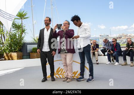 Michel TOESCA, Cedric Herrou and guests attends the 'Libre' Photocall during the 71st annual Cannes Film Festival at Palais des Festivals | Michel TOESCA, Cedric Herrou et des invités assistent au Photocall de 'Libre' lors du 71ème Festival de Cannes au Palais des Festivals. 18/05/2018 Stock Photo