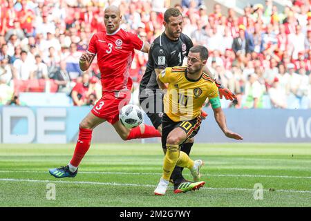 Belgium's Eden Hazard scores the 4-1 goal between Tunesia's goalkeeper Farouk Ben Mustapha and Tunesia's Yohan Benalouane at the second game of Belgian national soccer team the Red Devils against Tunisia national team in the Spartak stadium, in Moscow, Russia, Saturday 23 June 2018. Belgium won its first group phase game. BELGA PHOTO BRUNO FAHY Stock Photo