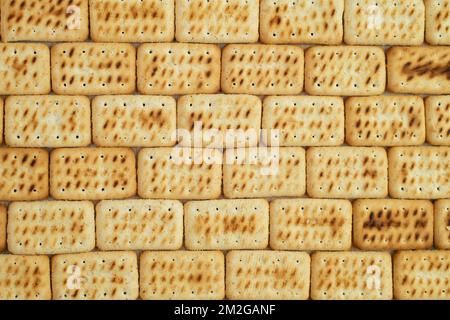 dried biscuits arranged like wall bricks, seamless texture background Stock Photo