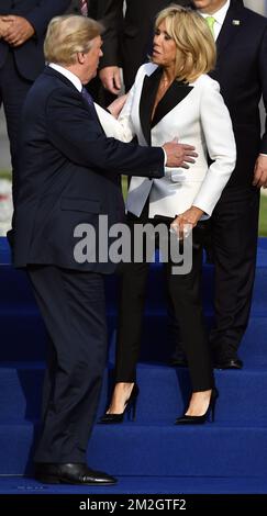 US President Donald Trump greets Brigitte Macron as they pose for a family picture, ahead of a dinner at the Parc du Cinquantenaire - Jubelpark park in Brussels, for the participants of a NATO (North Atlantic Treaty Organization) summit, Wednesday 11 July 2018. BELGA PHOTO ERIC LALMAND  Stock Photo