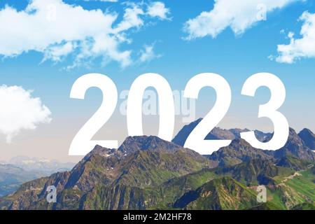 New Year is not far off. The concept of the approaching new year 2023. The numbers appearing from behind the mountains Stock Photo