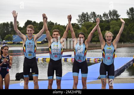 Belgian triathlete Marten Van Riel , Belgian triathlete Jelle Geens, Belgian triathlete Claire Michel and Belgian triathlete Valerie Barthelemy celebrate on the podium of the Mixed Team Relay triathlon event at the European Championships, in Glasgow, Scotland, Saturday 11 August 2018. European championships of several sports will be held in Glasgow from 03 to 12 August. BELGA PHOTO ERIC LALMAND  Stock Photo