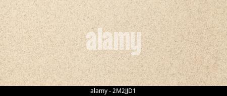 Texture of old light beige paper backdrop, closeup. Structure of a matte dense cardboard, ivory wallpaper. Cream felt background. Stock Photo