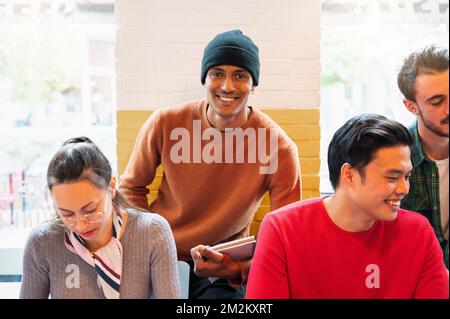 Multiracial group of young people studying together. Stock Photo