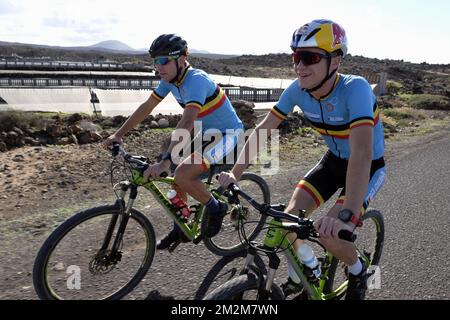 Belgian triathlete Jelle Geens and Belgian triathlete Marten Van Riel pictured in action during a training camp organized by the BOIC-COIB Belgian Olympic Committee in Lanzarote, Spain, Sunday 11 November 2018. BELGA PHOTO ERIC LALMAND Stock Photo