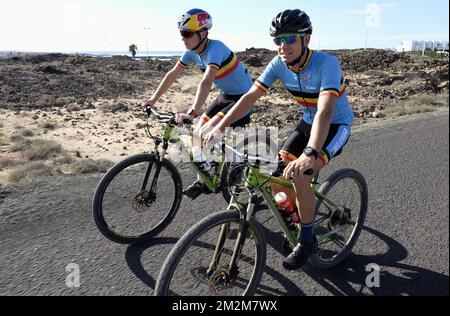 Belgian triathlete Marten Van Riel and Belgian triathlete Jelle Geens pictured in action during a training camp organized by the BOIC-COIB Belgian Olympic Committee in Lanzarote, Spain, Sunday 11 November 2018. BELGA PHOTO ERIC LALMAND Stock Photo