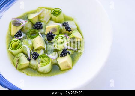 Luxury gourmet food. Elegant gourmet white plate top view lunch dinner dish meal as fine dining closeup green cucumber avocado seafood beauty Stock Photo