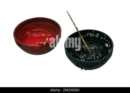 Making paints from herbs and minerals for coloring medieval retro fabrics and vintage clothes, isolated on a white background. Reconstruction of the e Stock Photo