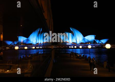 Sydney, Australia. 14th December 2022. Sydney Opera House was illuminated in blue to pay tribute to the two police officers Constable Matthew Arnold and Constable Rachel McCrow were shot dead in the line of duty at Wieambilla in the Western Downs on Tuesday. Pictured: reflected in the window of the Park Hyatt Hotel. Credit: Richard Milnes/Alamy Live News Stock Photo