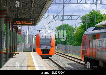 Moscow. Russia. Lastochka electric trains on the platform of the Upper Boilers station of the Moscow Central Ring (MCC) Stock Photo