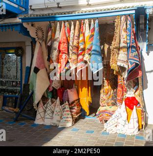 Traditional rugs hanging on display outside shop in medina area of Essaouira, Morocco, north Africa Stock Photo